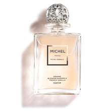 Load image into Gallery viewer, Bottle of Michel Germain orange blossom parfum with golden hue