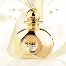 Load image into Gallery viewer, Gold perfume bottle labeled 'sexual Gold Vanille' with a decorative ribbon on a light background.