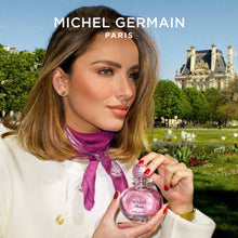 Load image into Gallery viewer, Woman holding Sexual Paris perfume by Michel Germain in Paris - luxury Paris perfume