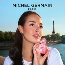 Load image into Gallery viewer, Woman applying Sexual Paris perfume by Michel Germain at Seine River - Paris perfume lifestyle