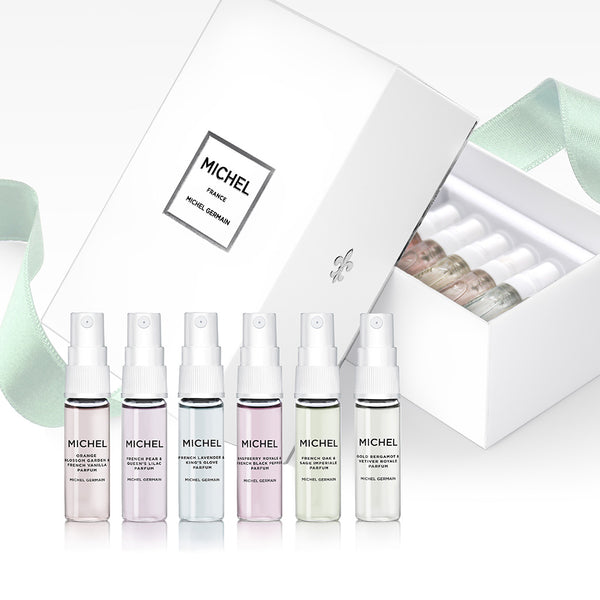Six 4ml Michel Germain perfume vials displayed upright, including French Pear and Queen’s Lilac