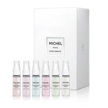 Load image into Gallery viewer, Top-down view of six Michel Germain 4ml perfume vials from the Discovery Set, featuring French Pear and Queen’s Lilac