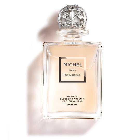 Bottle of Michel Germain orange blossom parfum with golden hue