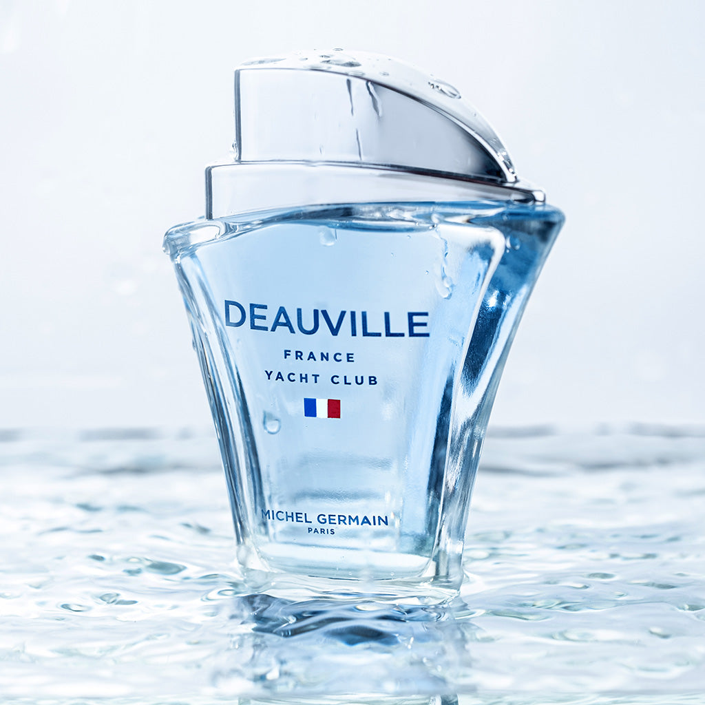 Deauville Michel Germain Yacht Club cologne bottle splashing in blue water scene