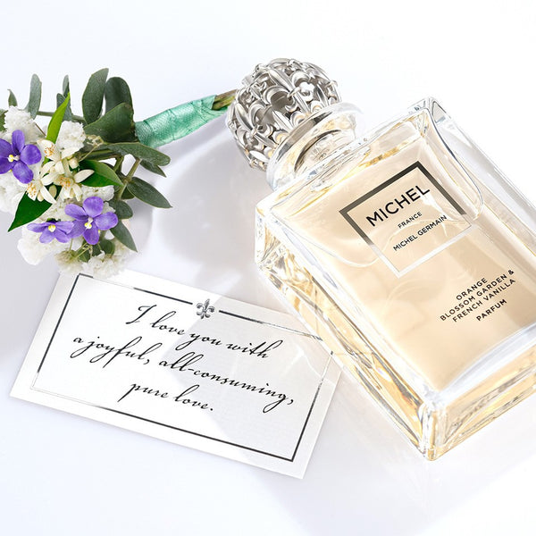 Michel Germain orange blossom and vanilla perfume with love note and flowers
