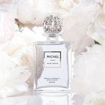 Lavender parfum bottle featured with blooming peonies for an elegant presentation