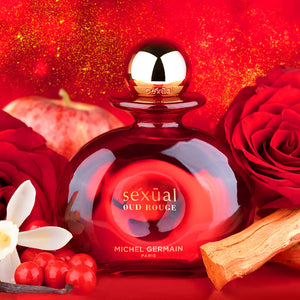 Sexual Oud Rouge perfume bottle with red rose, apple, and spice on red backdrop