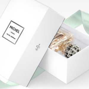 Michel Germain orange vanilla perfume in elegant white gift box with ribbon