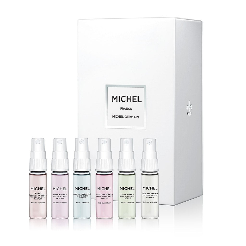 Top-down view of six Michel Germain 4ml perfume vials from the Discovery Set, featuring French Pear and Queen’s Lilac