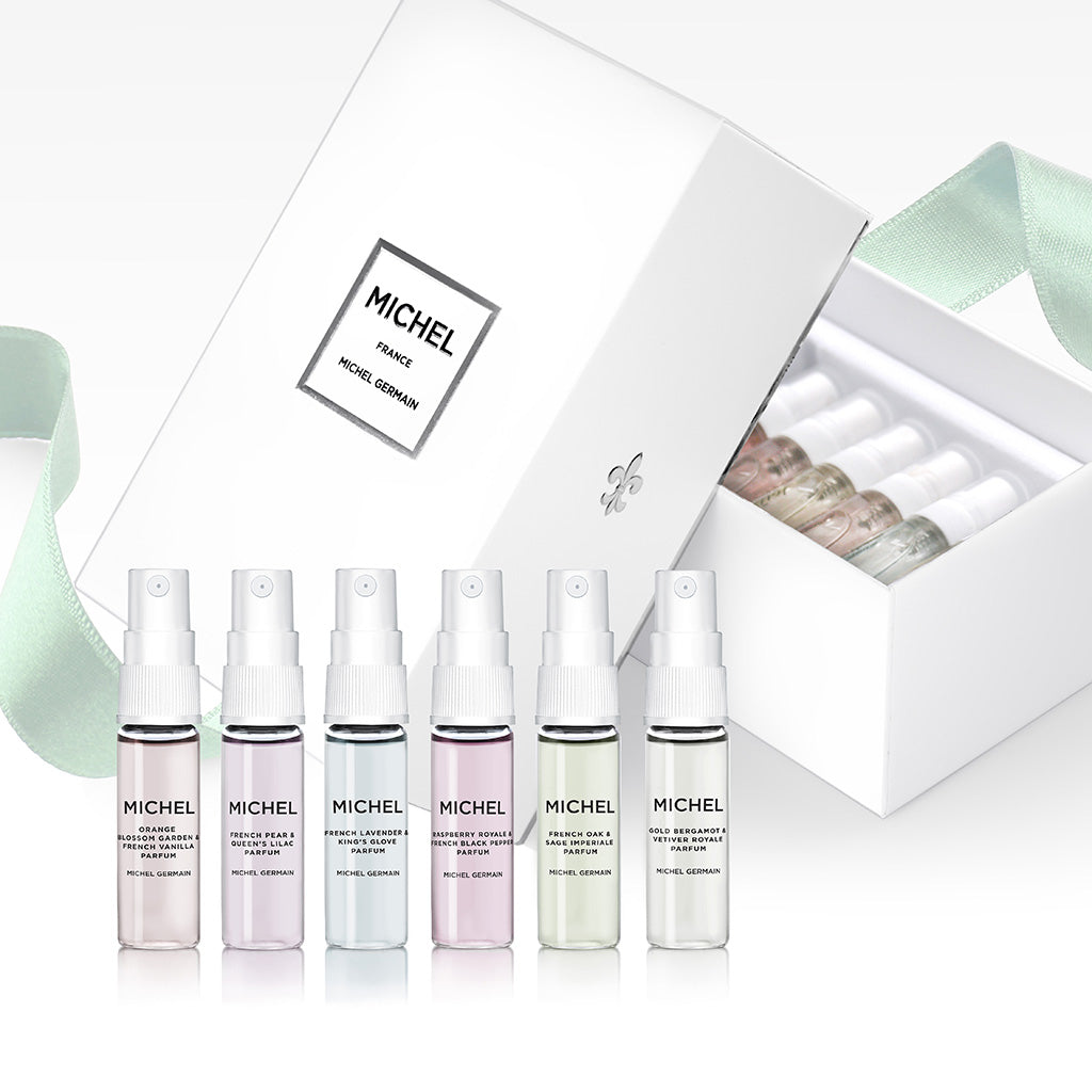 Six 4ml Michel Germain perfume vials displayed upright, including French Pear and Queen’s Lilac
